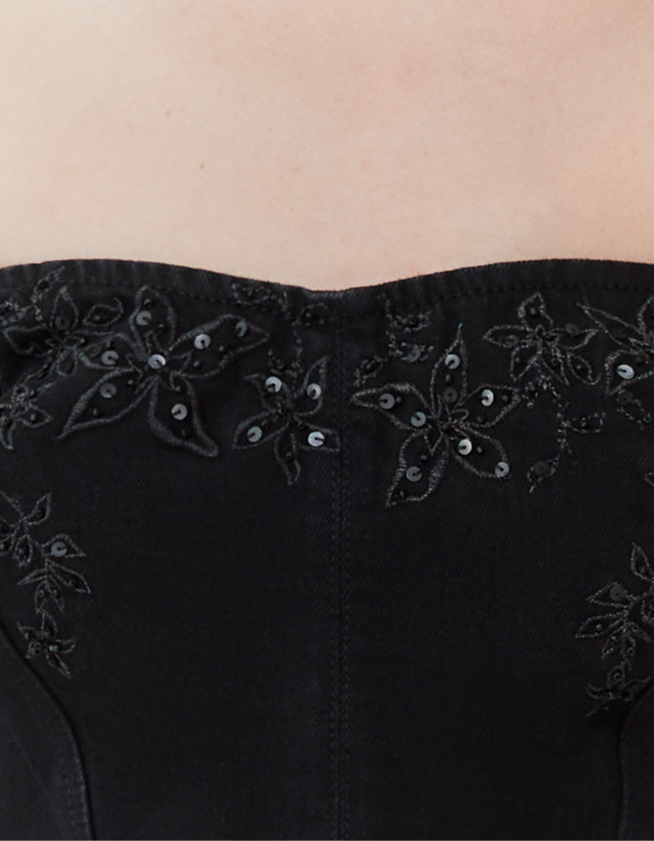 Women's black denim bustier with embroidered flowers