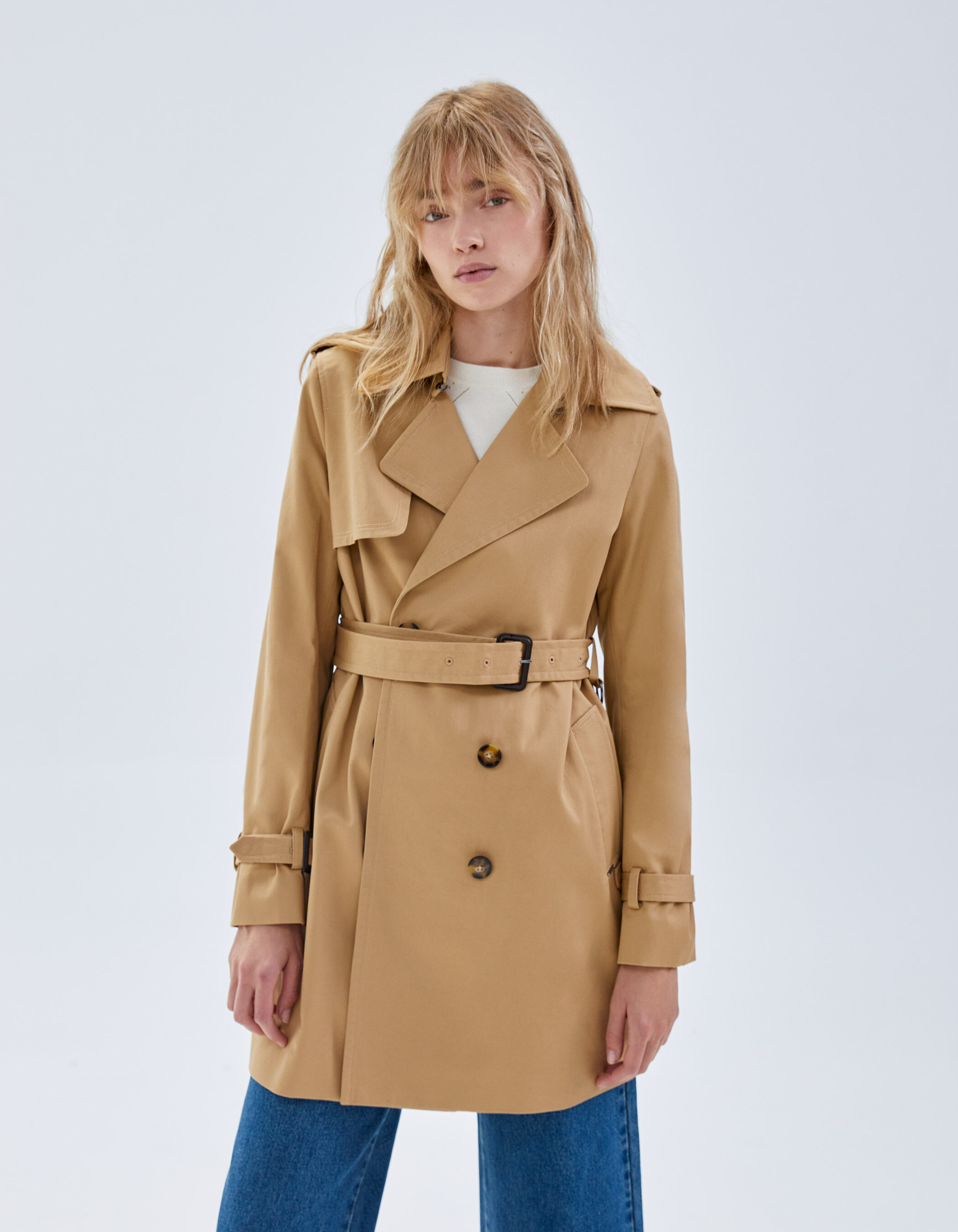 Women's beige belted mid-length trench coat