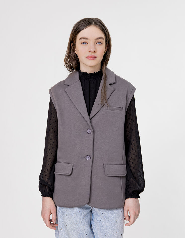 Chaqueta sin mangas polar gris espíritu niña-1