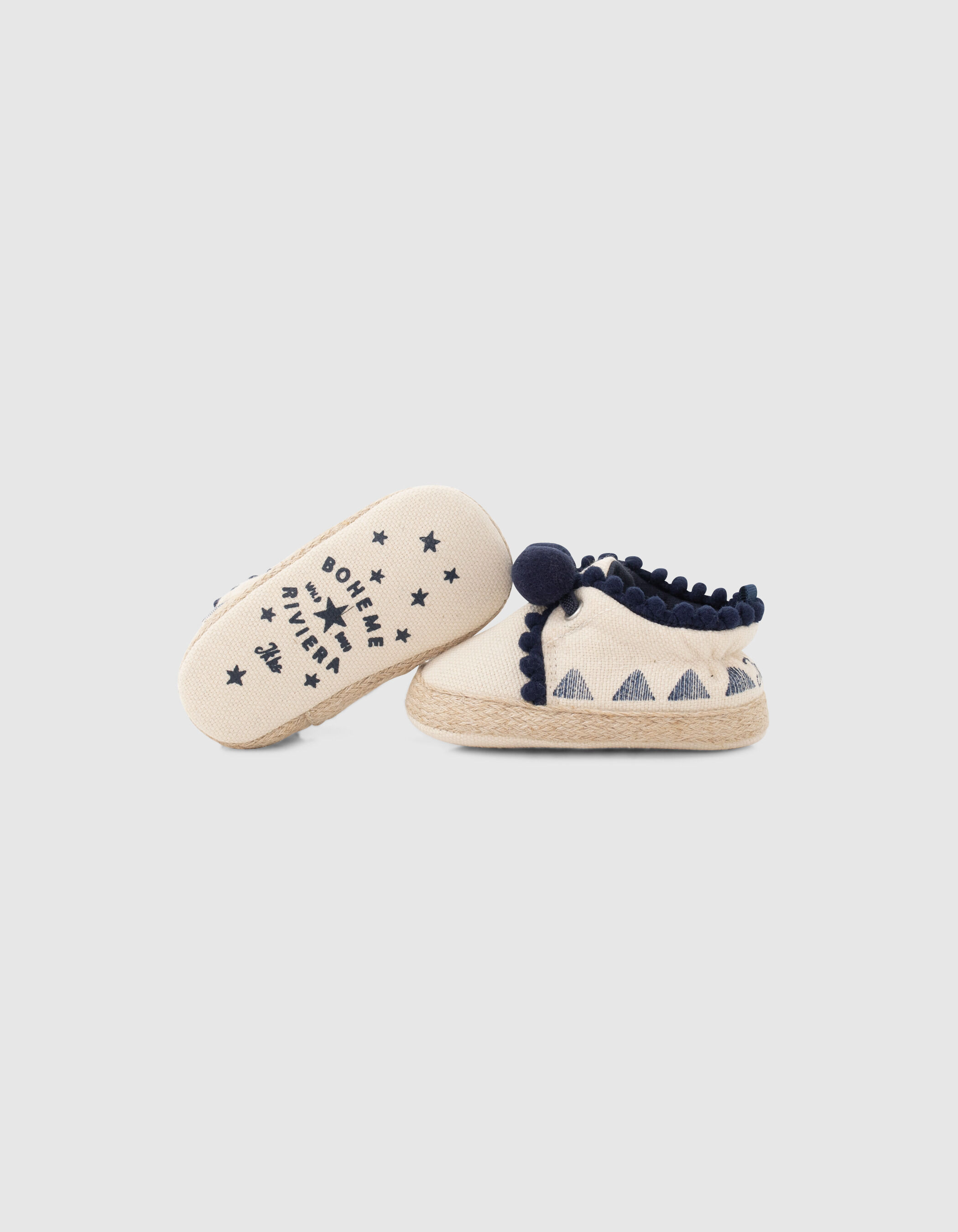 Chaussures blanc cass en toile avec pompons b b fille