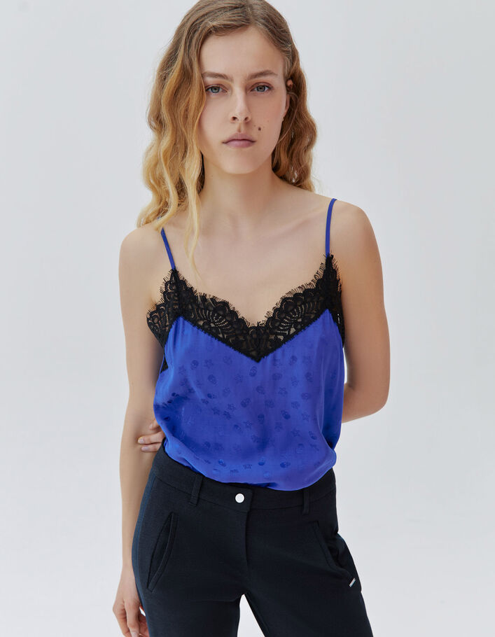 Women's blue lingerie-style top with skull motif