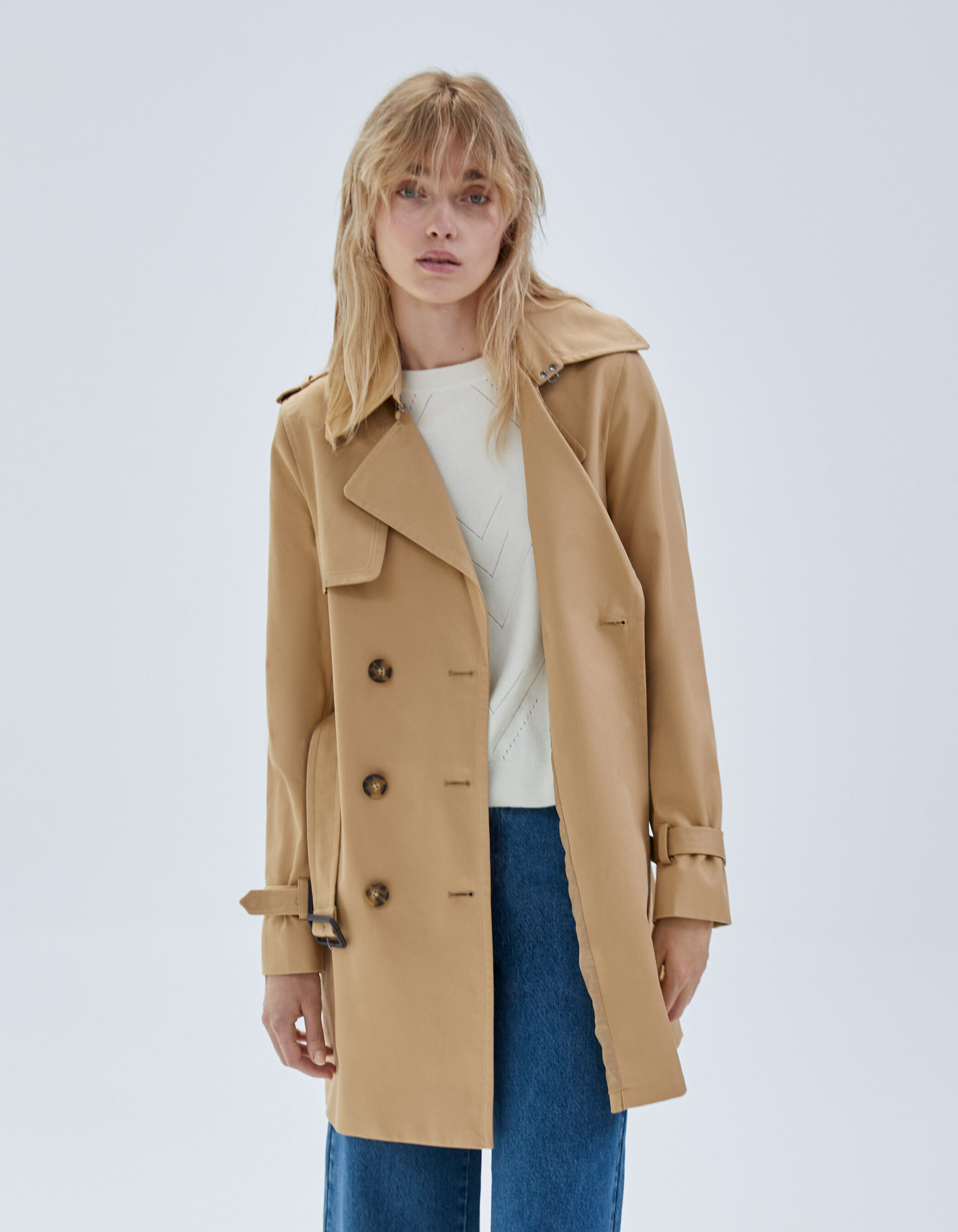 Women's beige belted mid-length trench coat