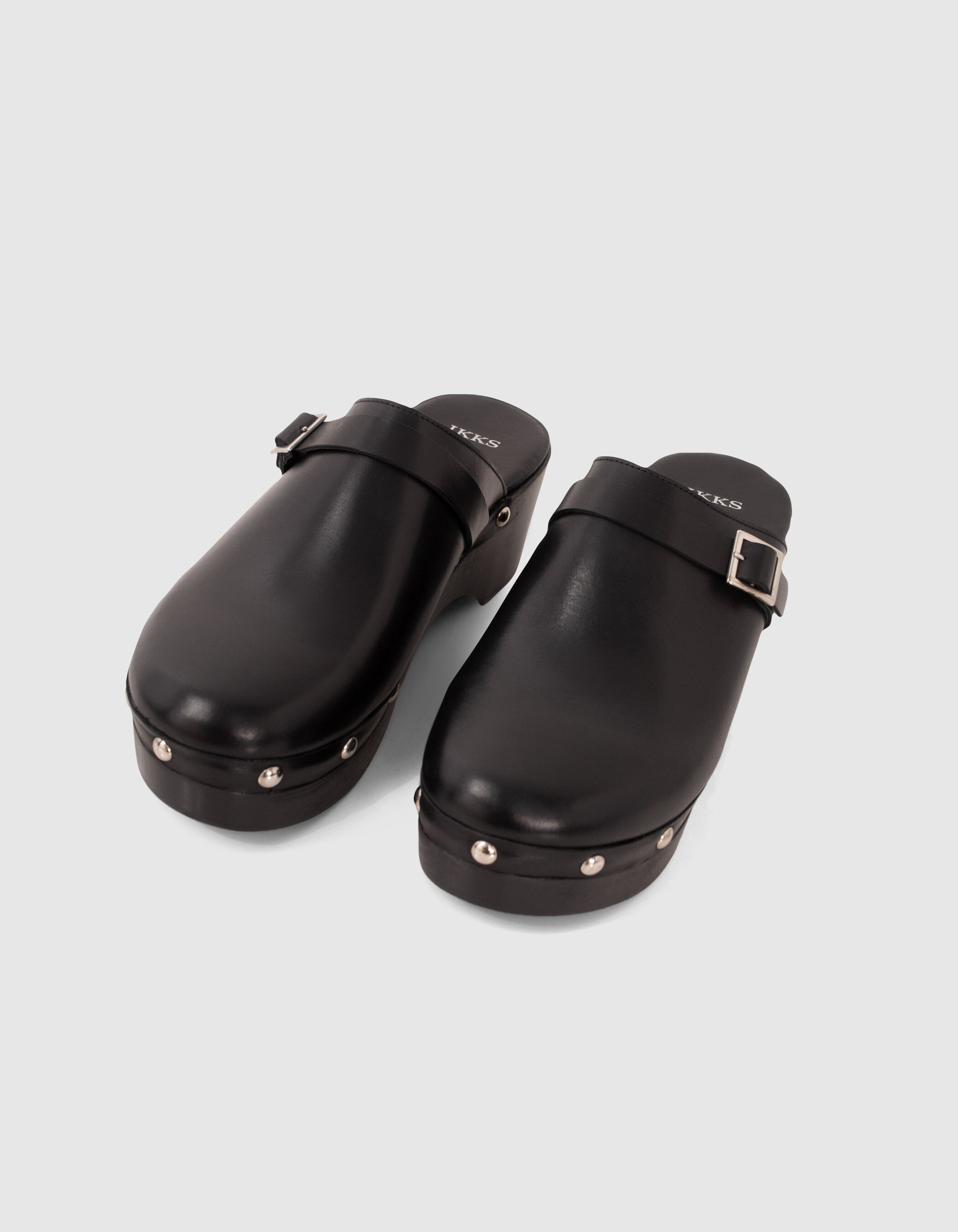 Women's black studded leather clogs with wooden heel