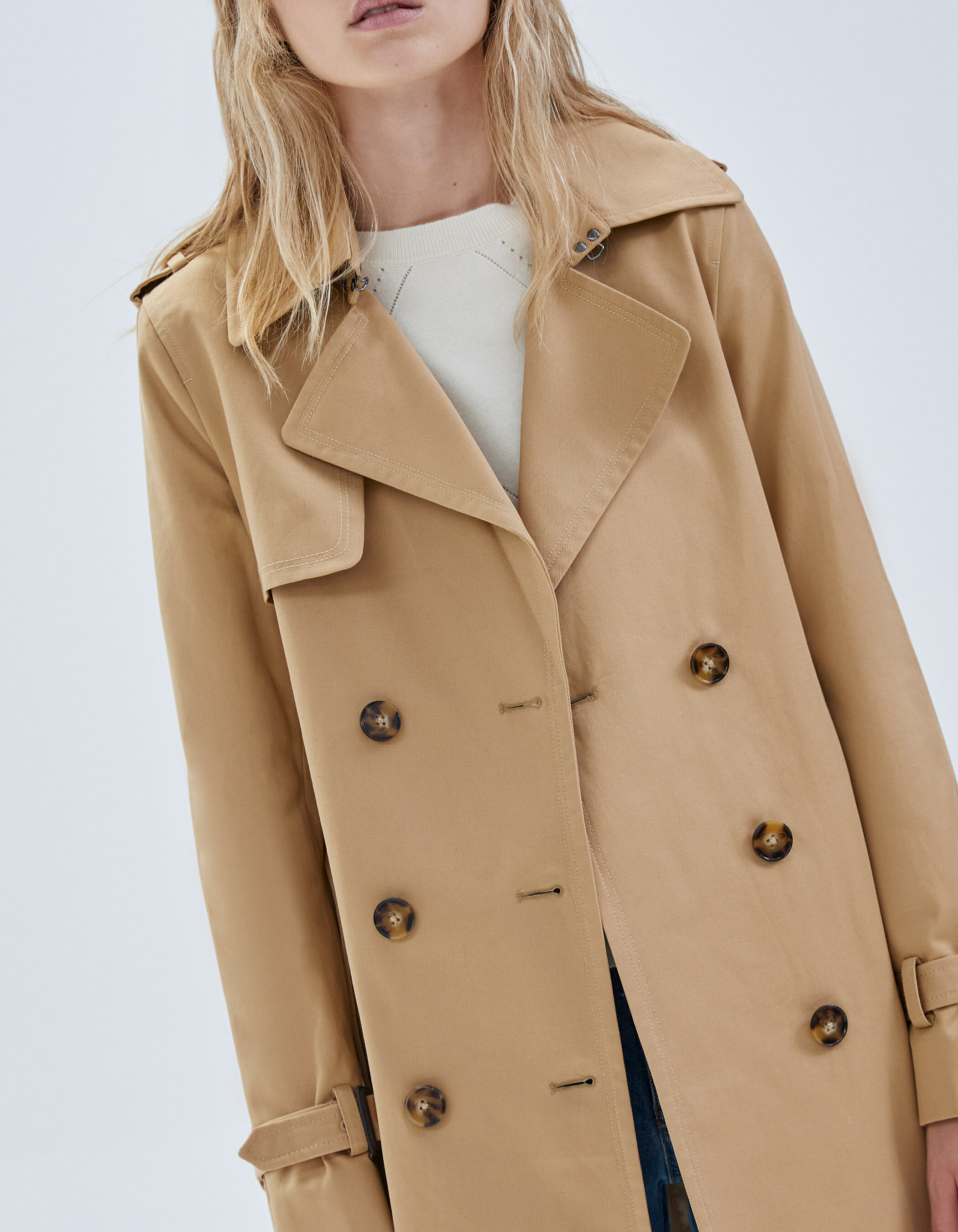 Women's beige belted mid-length trench coat